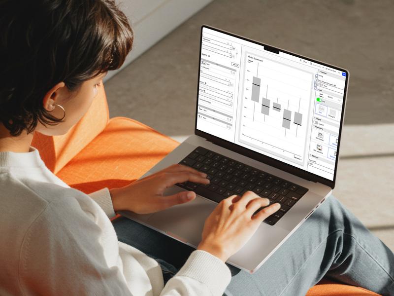 A user building a chart in the Celonis Visual Editor on a MacBook, with the layer configuration panel and live chart preview side by side